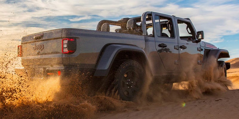 2026 Jeep Gladiator on trail with truck bed loaded