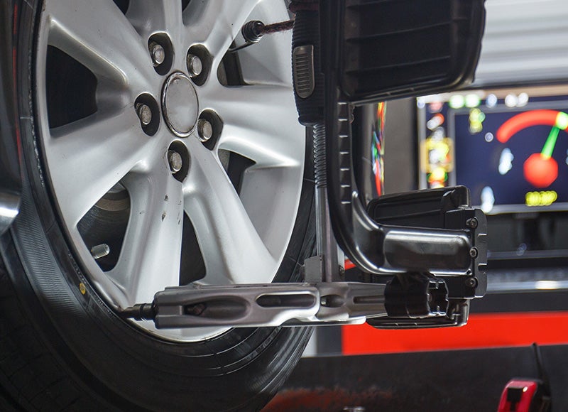 Certified technician installing a new tire at a Cable Dahmer service center